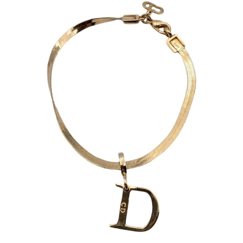 Dior gold dangling D bracelet